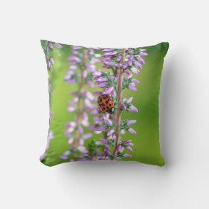 Ladybird on purple flowers  throw pillow