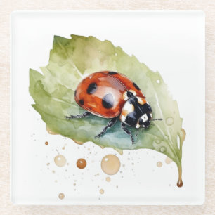 Ladybug sitting on a leaf in vibrant water colour glass coaster