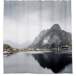 LAKE SURROUNDED BY HOUSES AND MOUNTAINS