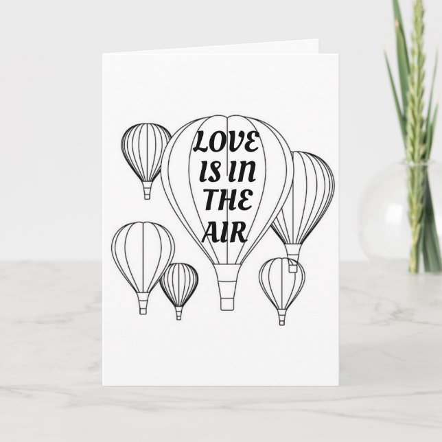 **L'AMOUR** EST DANS L'AIR **SUR NOTRE CARTE D'ANN (Devant)