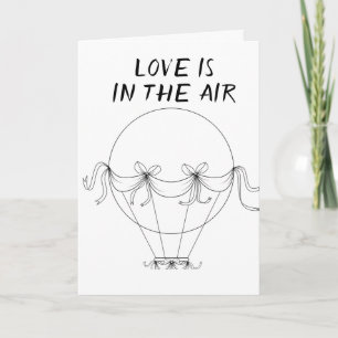 **L'AMOUR** EST EN L'AIR **SUR NOTRE CARTE ANNIVER