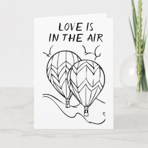 **L'AMOUR** EST EN L'AIR **SUR NOTRE CARTE ANNIVER
