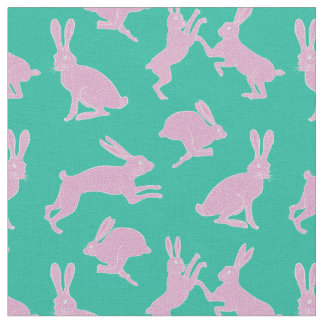 Lapins roses mignons sur le tissu vert d'arrière -