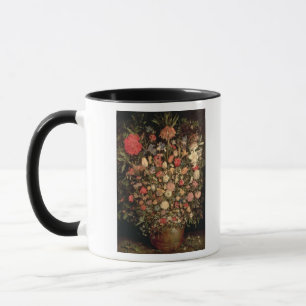 Large bouquet of flowers in a wooden tub mug