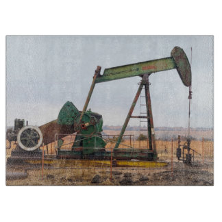 Large Green Pumpjack in an Oil Field Cutting Board