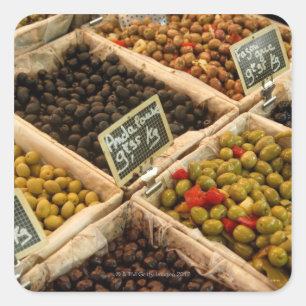 Large open boxes of black and green olives for square sticker