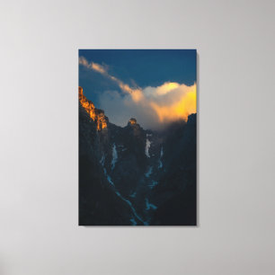 Last breath of sun shining on majestic mountains canvas print