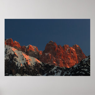 Last light of sun on mountains poster