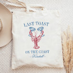 Last Toast on the Coast Lobster Bachelorette Tote Bag<br><div class="desc">Toast the bride at the beach with these cute coastal bachelorette party totes. "Last Toast on the Coast" appears in summery blue lettering,  with an illustration of a red lobster clinking two champagne coupe glasses. Personalize with each attendee's name for a cute welcome gift.</div>