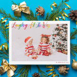 Laughing All The Way Cute Rainbow Christmas Photo Holiday Card<br><div class="desc">Beautiful,  colourful horizontal photo Christmas card with Laughing All the Way in pretty rainbow cursive script. Personalize with your favourite family photograph of your smiling kids above your name or custom greeting in red. Fun and cheerful holiday cards with a 2nd picture on the back.</div>