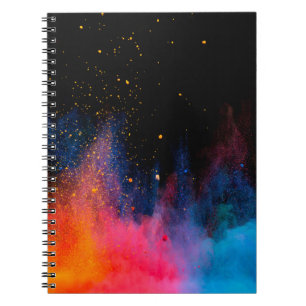 Launched colourful powder, isolated on black backg notebook