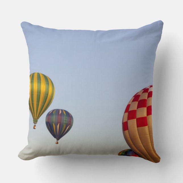 Launching hot air balloons throw pillow (Front)