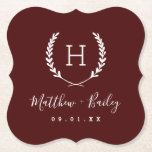Laurel Crest Wedding Monogram | Burgundy Paper Coaster<br><div class="desc">Personalize the template with the bride and groom's names or monogram initials. Add your wedding date, the city, state or venue name or any other custom text. This modern rustic logo-style design has a laurel branch frame with your monogram initial. Use the design tools to choose any colours, edit the...</div>