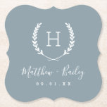 Laurel Crest Wedding Monogram | Dusty Blue Paper Coaster<br><div class="desc">Personalize the template with the bride and groom's names or monogram initials. Add your wedding date, the city, state or venue name or any other custom text. This modern rustic logo-style design has a laurel branch frame with your monogram initial. Use the design tools to choose any colours, edit the...</div>