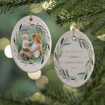 Laurel Wreath | Photo & Caption Christmas Ceramic Ornament<br><div class="desc">Elegant double sided photo ornament frames a favourite photo with an oval wreath of green watercolor laurel leaves on a light wood background. Personalize the back with your custom caption (shown with "[name's] first Christmas" and the year. Perfect for baby's first Christmas, first married Christmas, or to commemorate a special...</div>