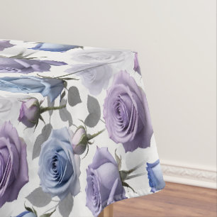 Lavender And Blue Roses Set On A Cloudy Grey Tablecloth