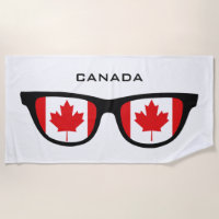 Le CANADA ombrage la serviette de plage faite sur