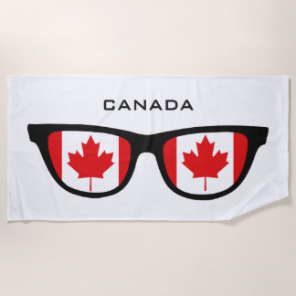 Le CANADA ombrage la serviette de plage faite sur