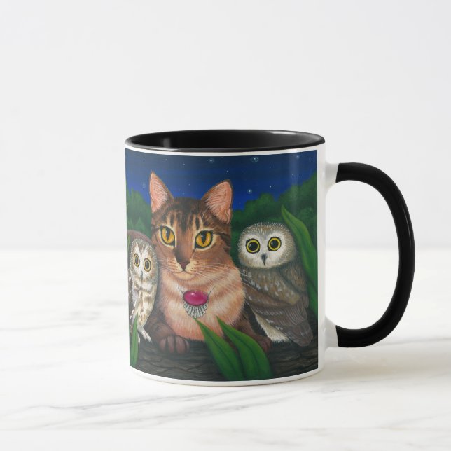 Le chat abyssinien a vu pour affûter la tasse (Droite)