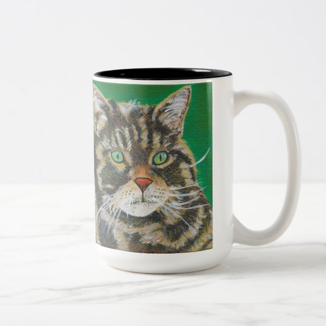 Le chat tigré, la tasse mignonne deux de Kitty a (Droit)