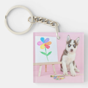 Le marionnettiste Husky Peint une fleur arc-en-cie