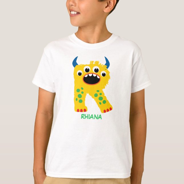 Le monstre marque avec des lettres le T-shirt (Devant)