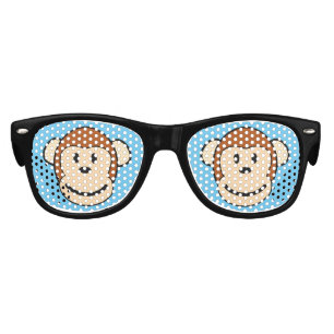 Le visage de singe badine des lunettes de soleil