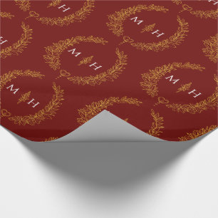 Leaf oval monogram drawing gold on dark red wrapping paper