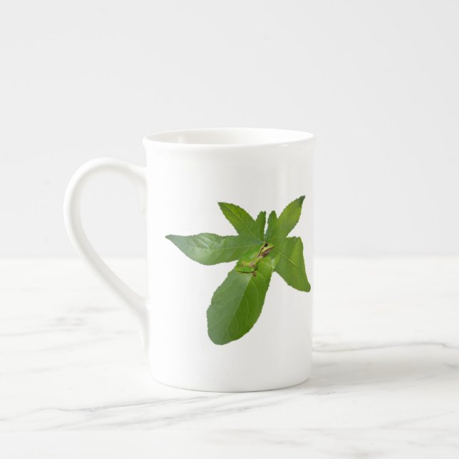 "Leafy Haven: A Small Green Frog on a Grape Leaf" Bone China Mug (Left)