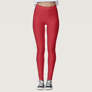 Leggings un arrière - plan rouge avec un