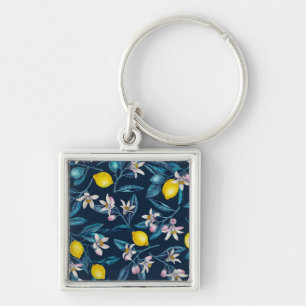 Lemon branches with blossoms and fruit on blue keychain