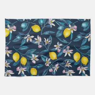 Lemon branches with blossoms and fruit on blue kitchen towel