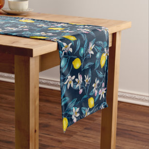 Lemon branches with blossoms and fruit on blue short table runner