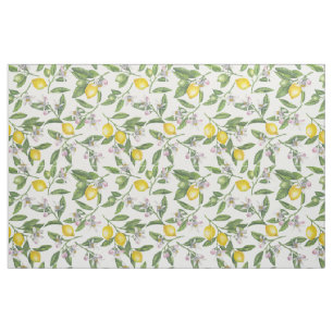 Lemon branches with blossoms and fruit on white fabric