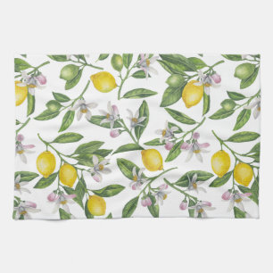 Lemon branches with blossoms and fruit on white kitchen towel