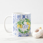 Lemon Greenery Wreath White Floral Blue Monogram Coffee Mug<br><div class="desc">Bridal party personalized monogram coffee mug to match your wedding theme will be a special reminder of that day and the special relationship you share. A hand painted watercolor botanical citrus wreath with hanging lemons, white flower blossoms and leaf greenery over a vintage Mediterranean mosaic diamond tile pattern inspired by...</div>