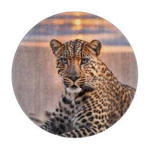 Leopard on the beach cutting board