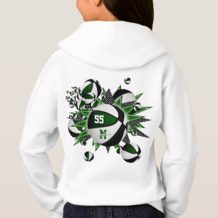 L'équipe de filles en noir vert couleurs basketbal