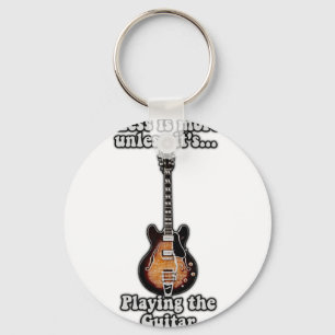 Less is more unless it's playing the guitar. brown keychain