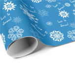 Let It Snow- Blue Wrapping Paper<br><div class="desc">Snowflakes in shades of blue and white dance over this festive wrapping paper.  Between the flakes are the words,  "Let It Snow!".  Also available in other colours.</div>