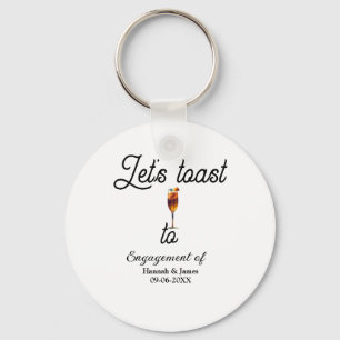 Let's toast to engagement party name date glass keychain