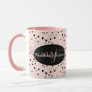 Lettres élégantes en or rose sur mug noir