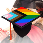 LGBTQ & Pride - Rainbow Progress Flag  Graduation Cap Topper<br><div class="desc">Graduation Topper Hat: Rainbow Flag & the "Progress" variation adds a chevron along the hoist that features black, brown, light blue, pink, and white stripes to bring those communities (marginalized people of colour, trans individuals, and those living with HIV/AIDS and those who have been lost) to the forefront; "the arrow...</div>