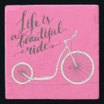 Life Is A Beautiful Ride Pink Stone Coaster<br><div class="desc">Life is a beautiful ride - modern Handwritten modern calligraphy,  inspirational quote for card on pink background with kick bike  | Bigstock® - All Rights Reserved.</div>