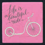 Life Is A Beautiful Ride Pink Stone Coaster<br><div class="desc">Life is a beautiful ride - modern Handwritten modern calligraphy,  inspirational quote for card on pink background with kick bike  | Bigstock® - All Rights Reserved.</div>