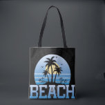 Life Is Better at the Beach Tote Bag<br><div class="desc">A relaxing tropical beach design featuring silhouetted palm trees against a soft sunset and ocean horizon, paired with the uplifting quote “Life Is Better at the Beach.” This artwork captures coastal vibes, summer relaxation, and island living, making it perfect for wall art, posters, T-shirts, hoodies, beachwear, home décor, and vacation-themed...</div>