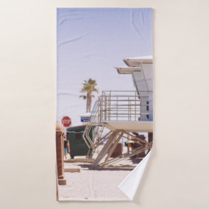 Lifeguard houses under bright skty bath towel