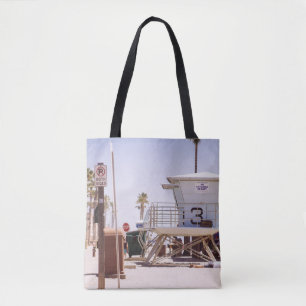 Lifeguard houses under bright skty tote bag