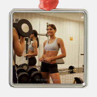 Lifting weights in the gym metal ornament