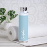 Light Blue Personalized Wedding Bridesmaid Water Bottle<br><div class="desc">Gift your wedding bridesmaid or maid of honour with this trendy, vacuum Insulated water bottle that features her name in white, stylized script on a light blue colour background designed to match your wedding colour scheme. Personalize bottle by editing and replacing name with your own as desired. Select your water...</div>